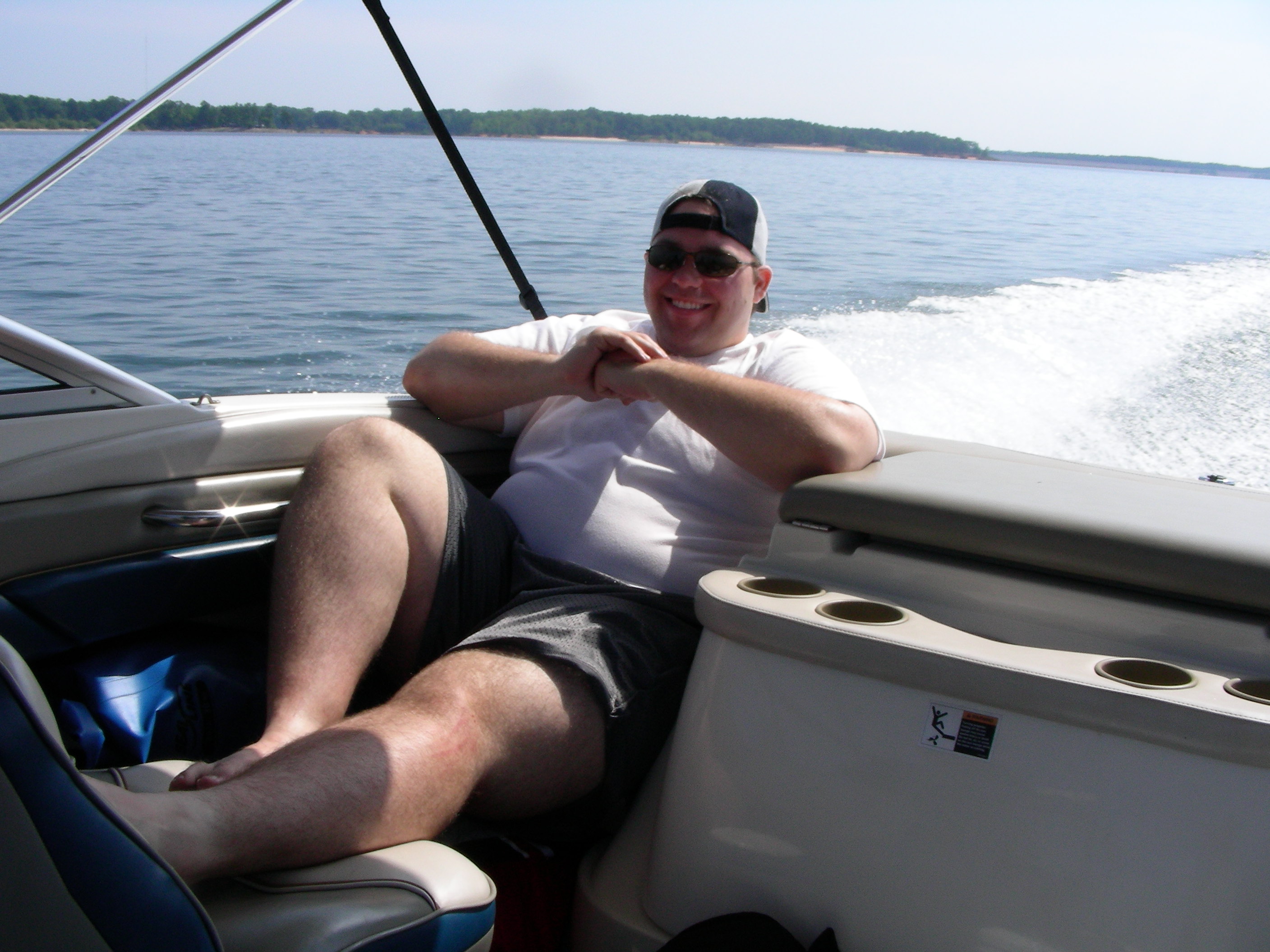 ./2010/Kerr Lake/Luis boating w guys 0002.JPG